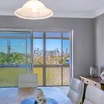 Bright Top-Floor Retreat With City Views