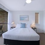 The Poolside Perch - A Breezy Balcony Gem